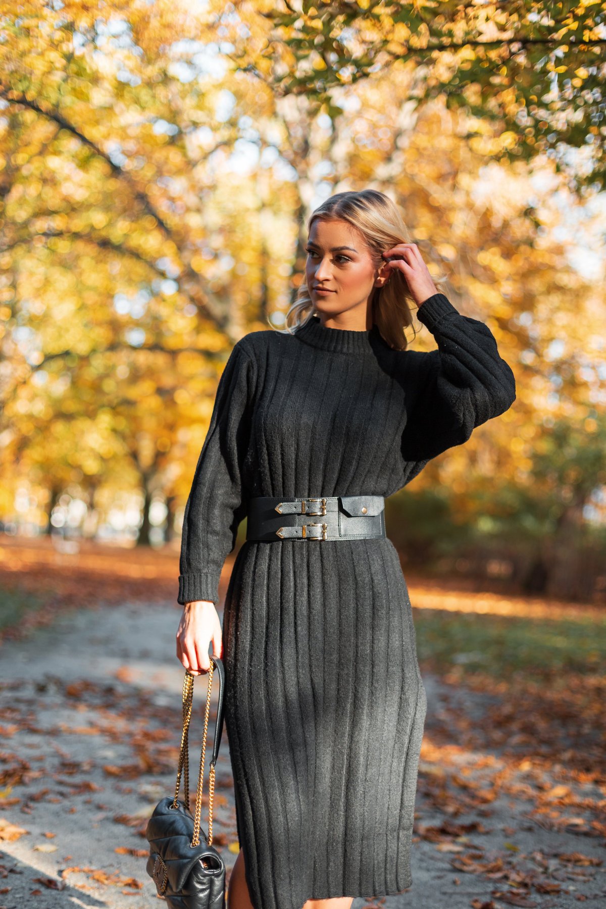 Fashion girl in vintage stylish knitted black dress